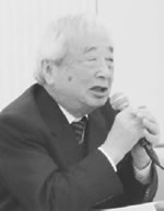 講演する野村拓氏